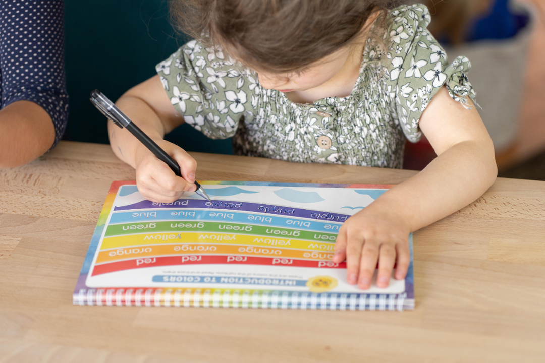 A grooved handwriting book with a special pen using disappearing ink for reusable practice.