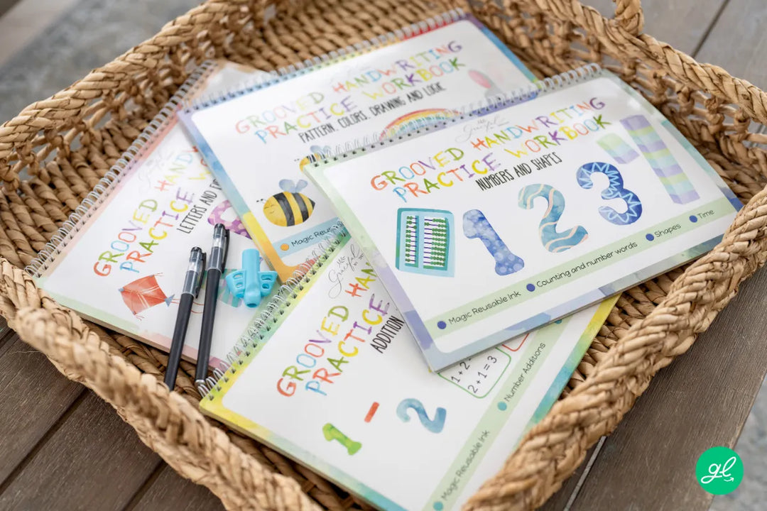 Addition and subtraction practice books on a desk next to a tablet to buy the best one.