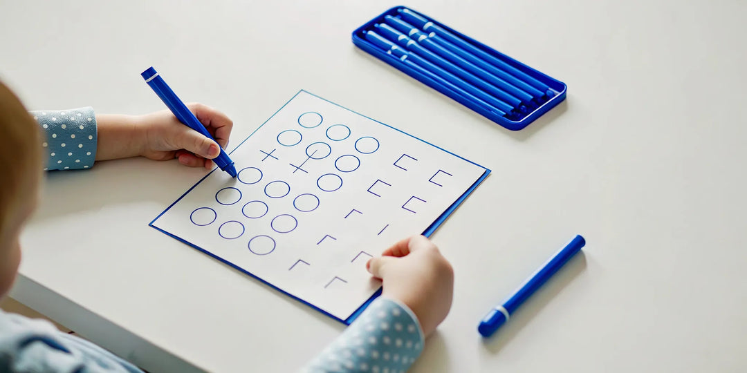 Child practicing with reusable workbooks for kids
